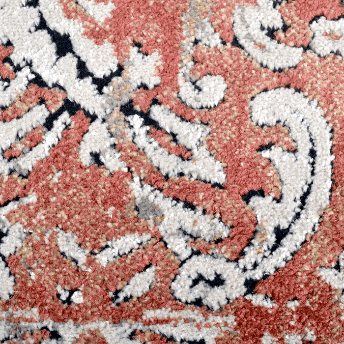 Detail of a CamRugs red distressed traditional area rug.