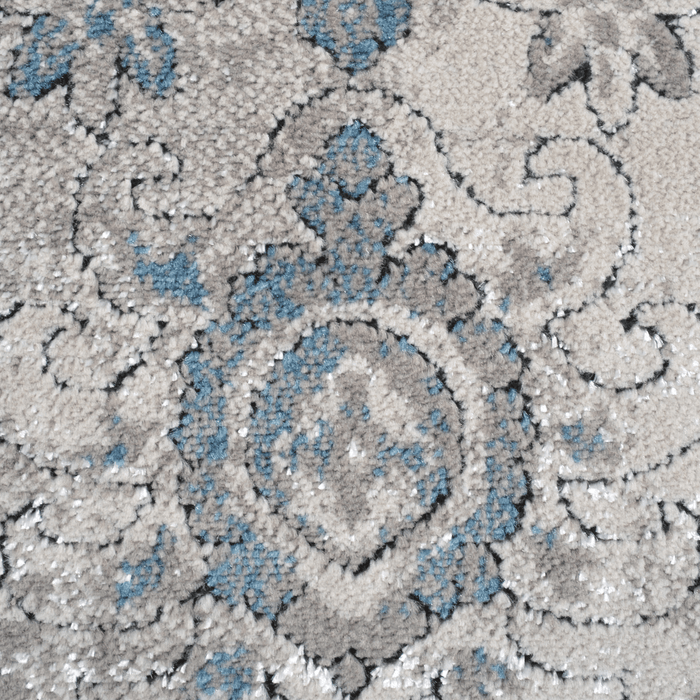 Detail of a CamRugs beige traditional area rug.