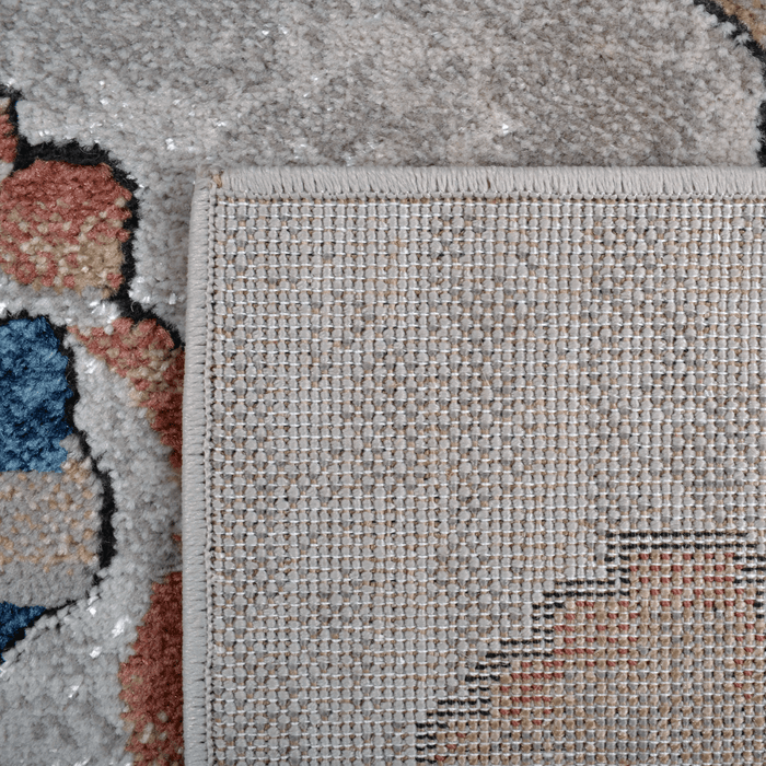 Back of a CamRugs beige geometric area rug.