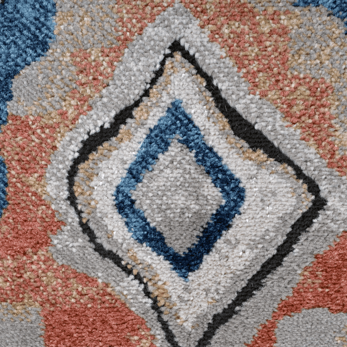 Detail of a CamRugs beige geometric area rug.