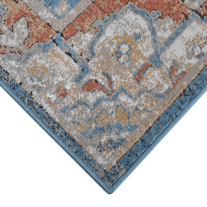 Corner of a CamRugs blue distressed traditional area rug.