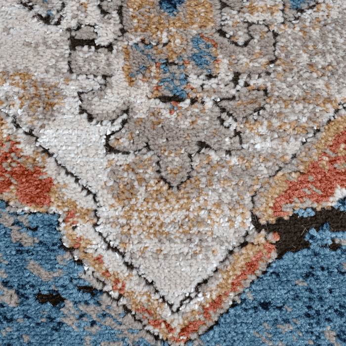 Detail of a CamRugs blue distressed traditional area rug.