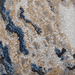 Detail of a CamRugs blue marble area rug.