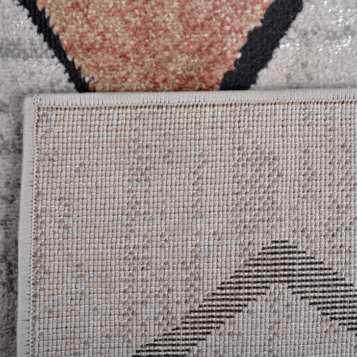 Back of a CamRugs multi-colour geometric area rug.