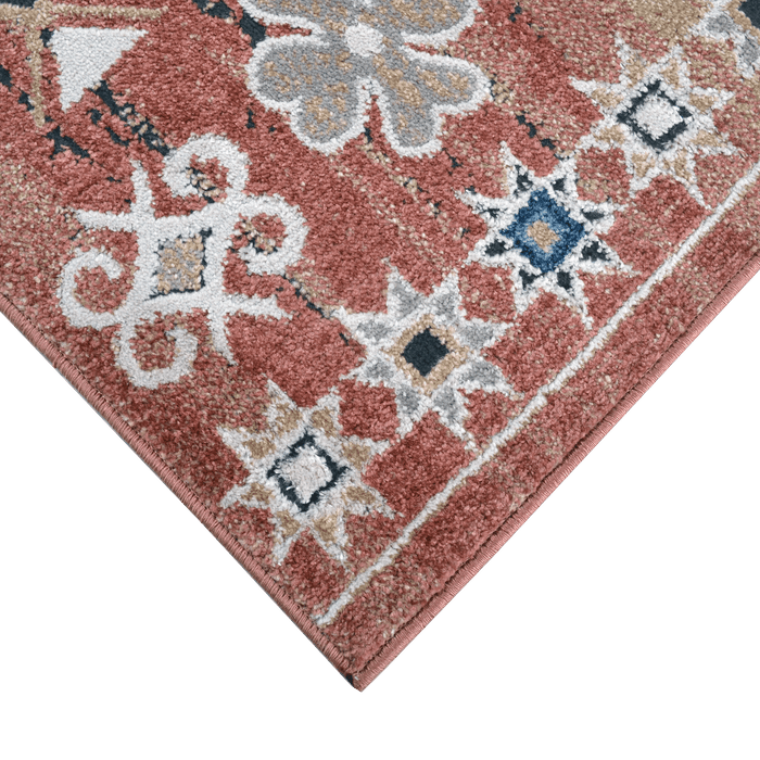 Corner of a CamRugs red geometric traditional area rug.