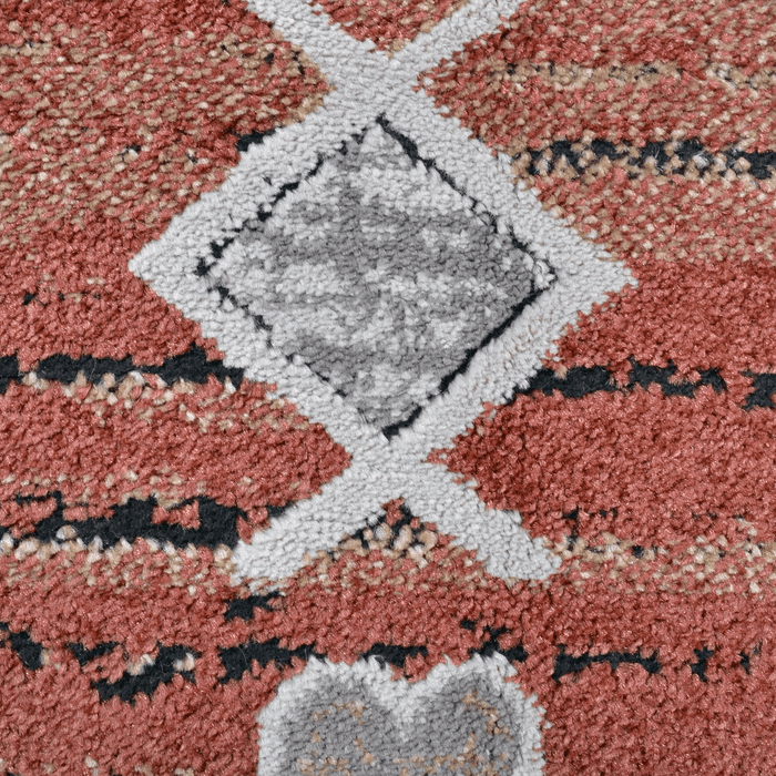 Detail of a CamRugs red geometric traditional area rug.