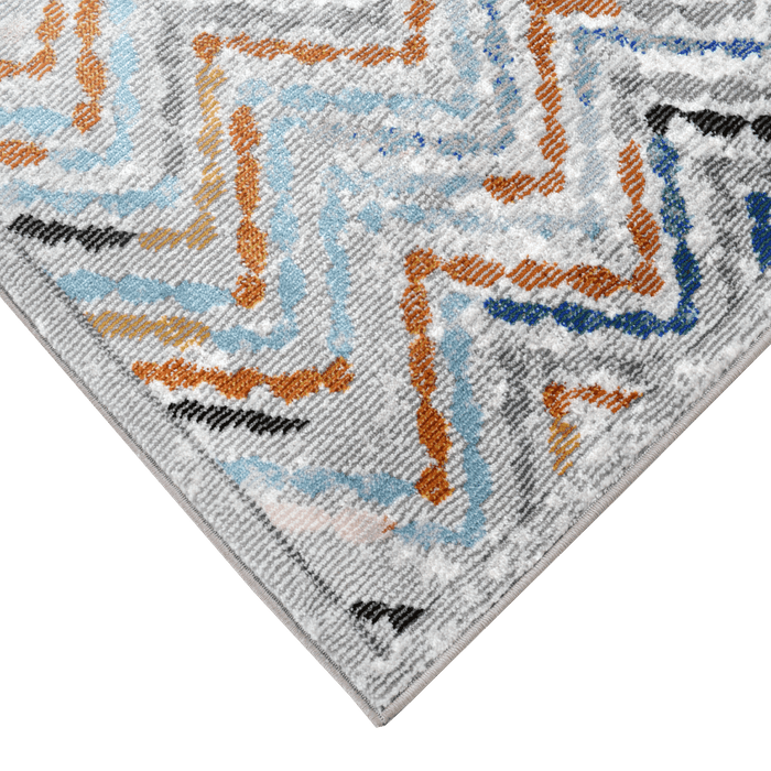 Corner of a CamRugs cream geometric area rug.