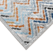 Corner of a CamRugs cream geometric area rug.