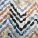 Detail of a CamRugs cream geometric area rug.