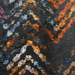 Detail of a CamRugs black geometric area rug.