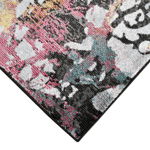 Corner of a CamRugs black floral area rug.