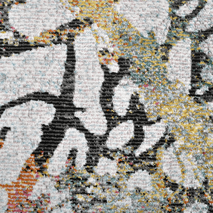 Detail of a CamRugs black floral area rug.