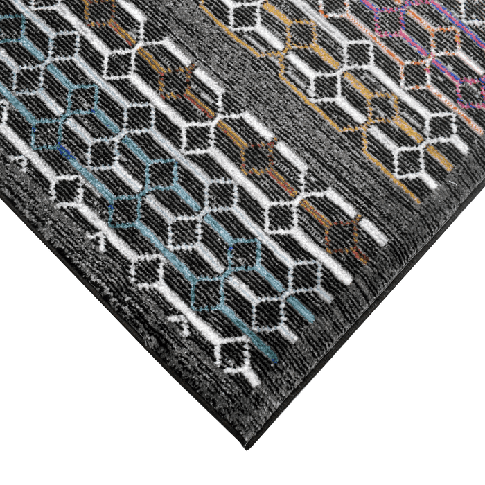 Corner of a CamRugs black and multi-colour geometric area rug.
