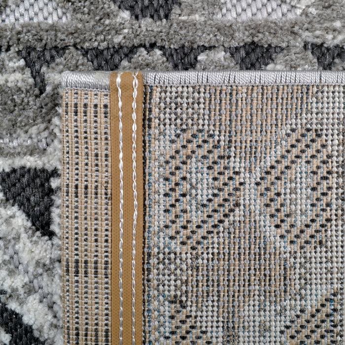 Back of a CamRugs grey geometric area rug.