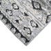 Corner of a CamRugs grey geometric area rug.