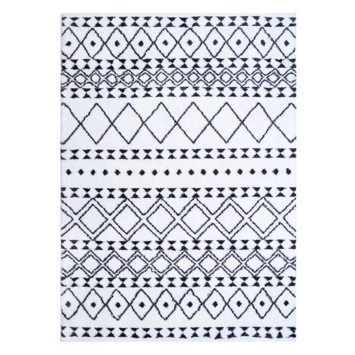 A black and white area rug with geometric designs.