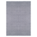 A blue flat weave area rug with geometric diamond designs.