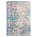 A blue and pink textured area rug with distressed traditional floral motif designs.