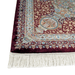 A corner of an Authentic Red Modal Silk area rug with traditional floral motif designs.