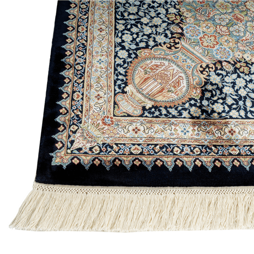 A corner of an Authentic Blue Modal Silk area rug with traditional floral motif designs.