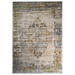 A beige area rug with distressed traditional floral motifs.
