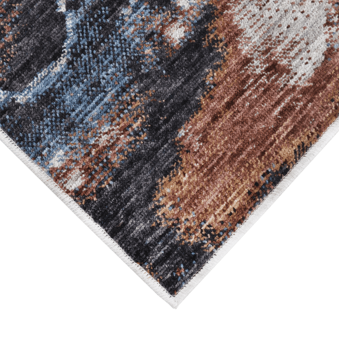 Corner of a CamRugs.Ca grey marble area rug, made from recycled materials.