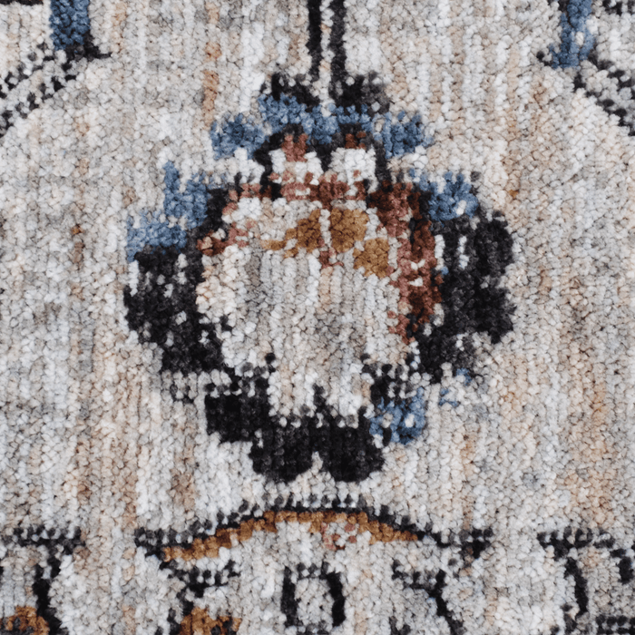 Detail of a CamRugs.Ca ivory traditional area rug, made from recycled materials.